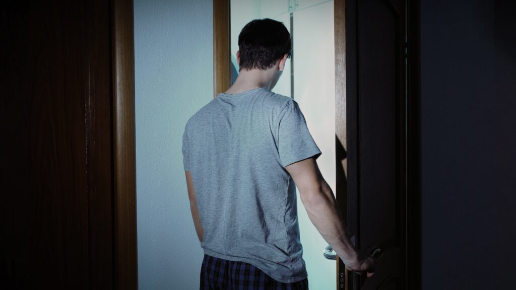 Busting Myths About Sleepwalking - image of man sleepwalking. Blog by Whitney Sleep Center