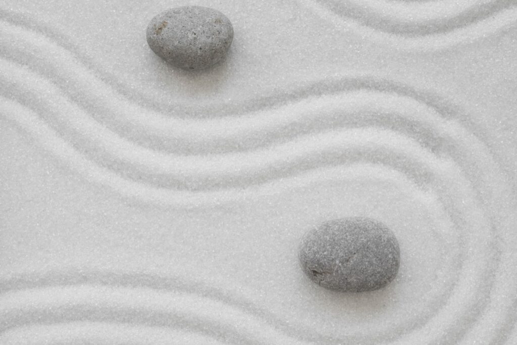 Zen stones on sand ground