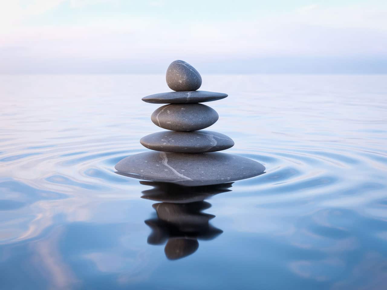 Stacked zen stones on water