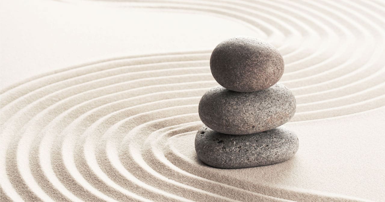 Stones on sand background