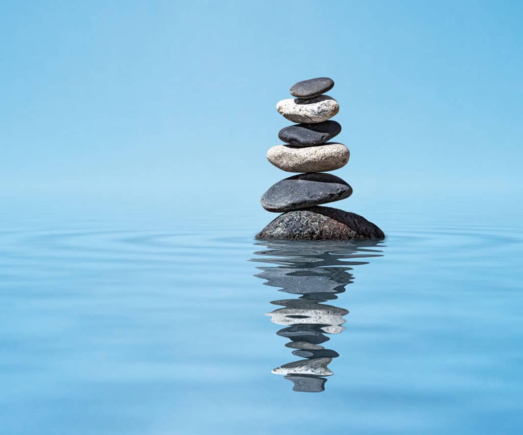 Stacked zen stones on water