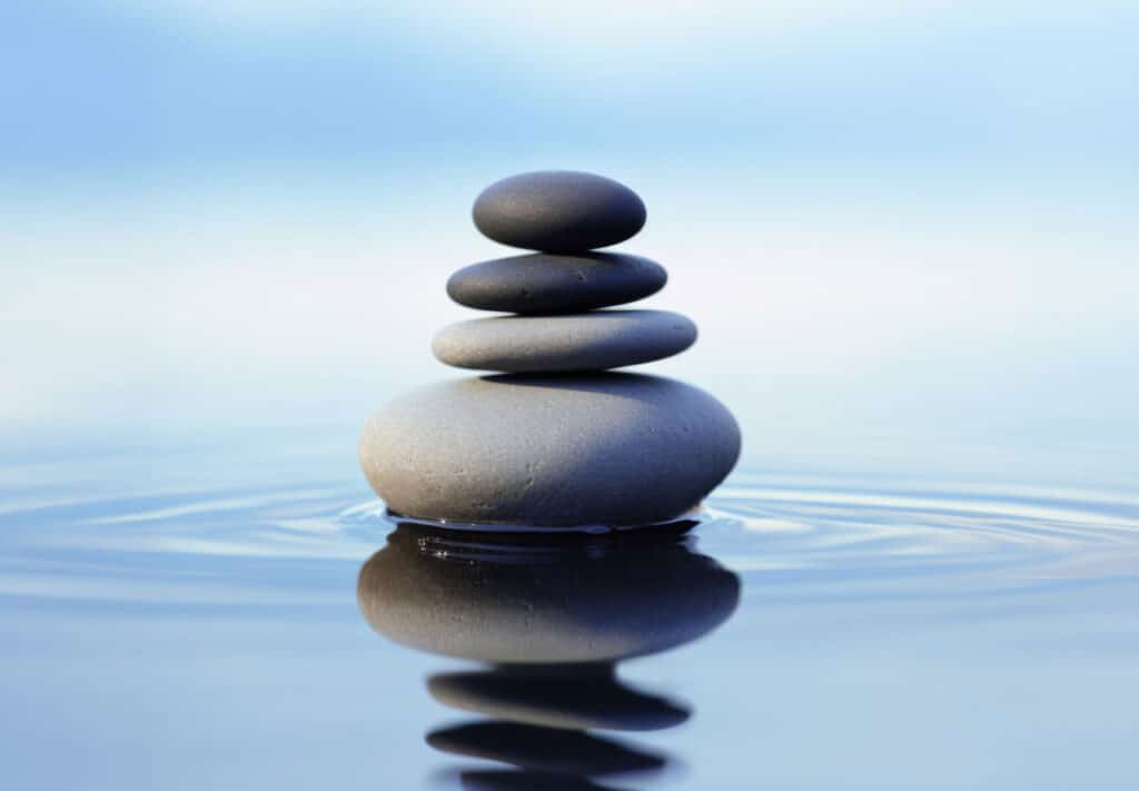 Stacked zen stones on water